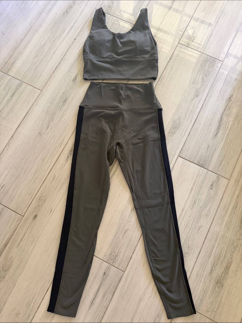 High-Waist Olive Green Leggings with Black Side Stripes and sports bra